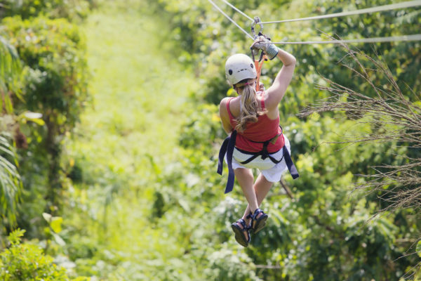 36636196 - woman going on a jungle zipline adventure