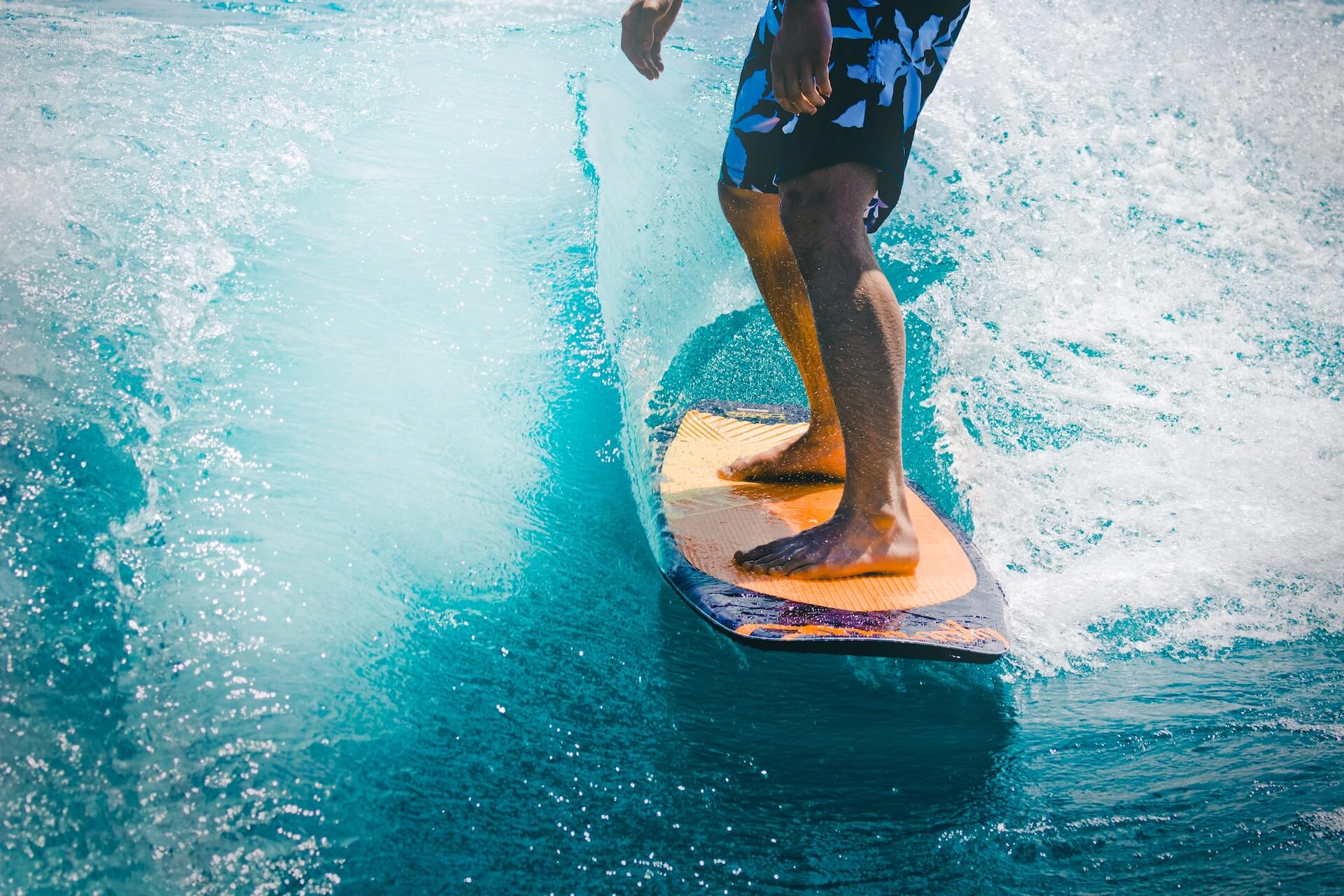close up of a man surfing on a wave
